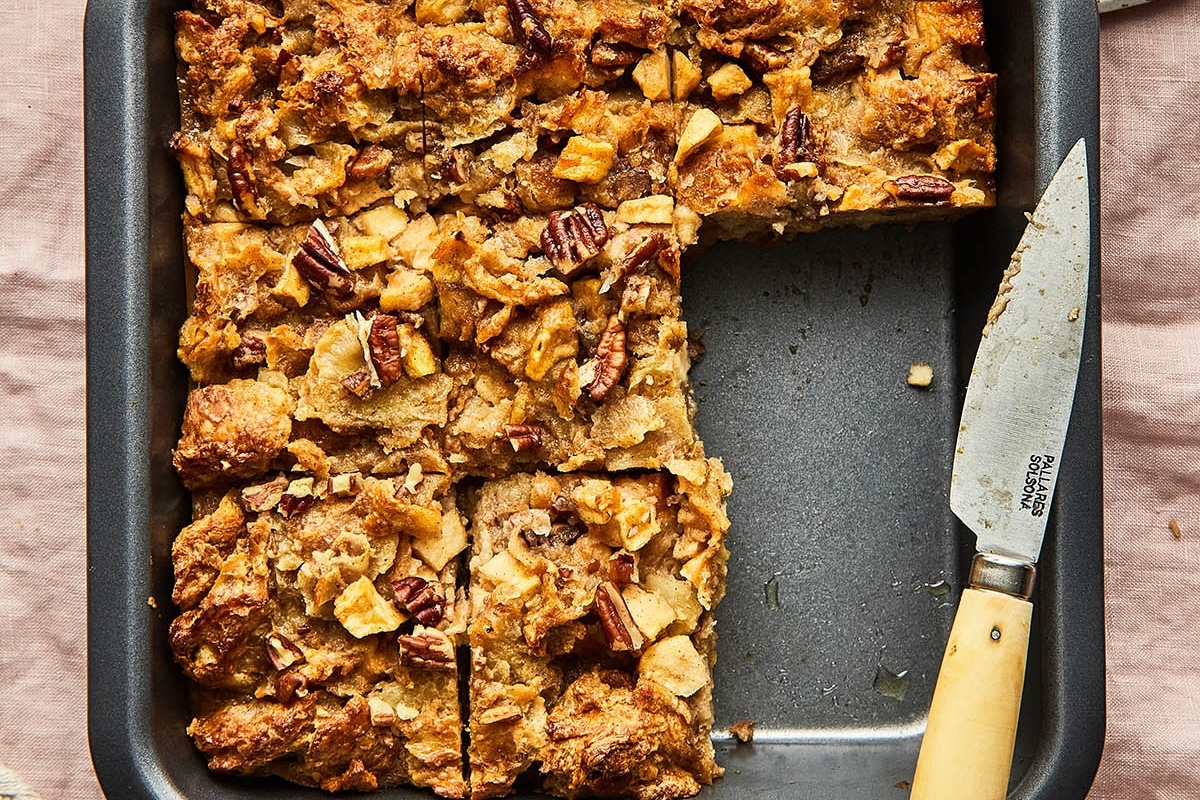 A sweet breakfast treat for Christmas with a pan, a piece of bread, and a knife.