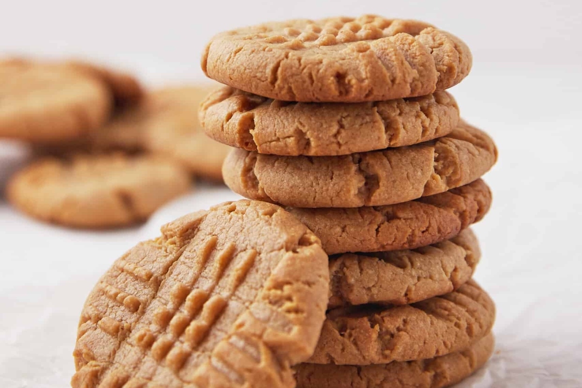 A stack of Christmas cookies on a white background.