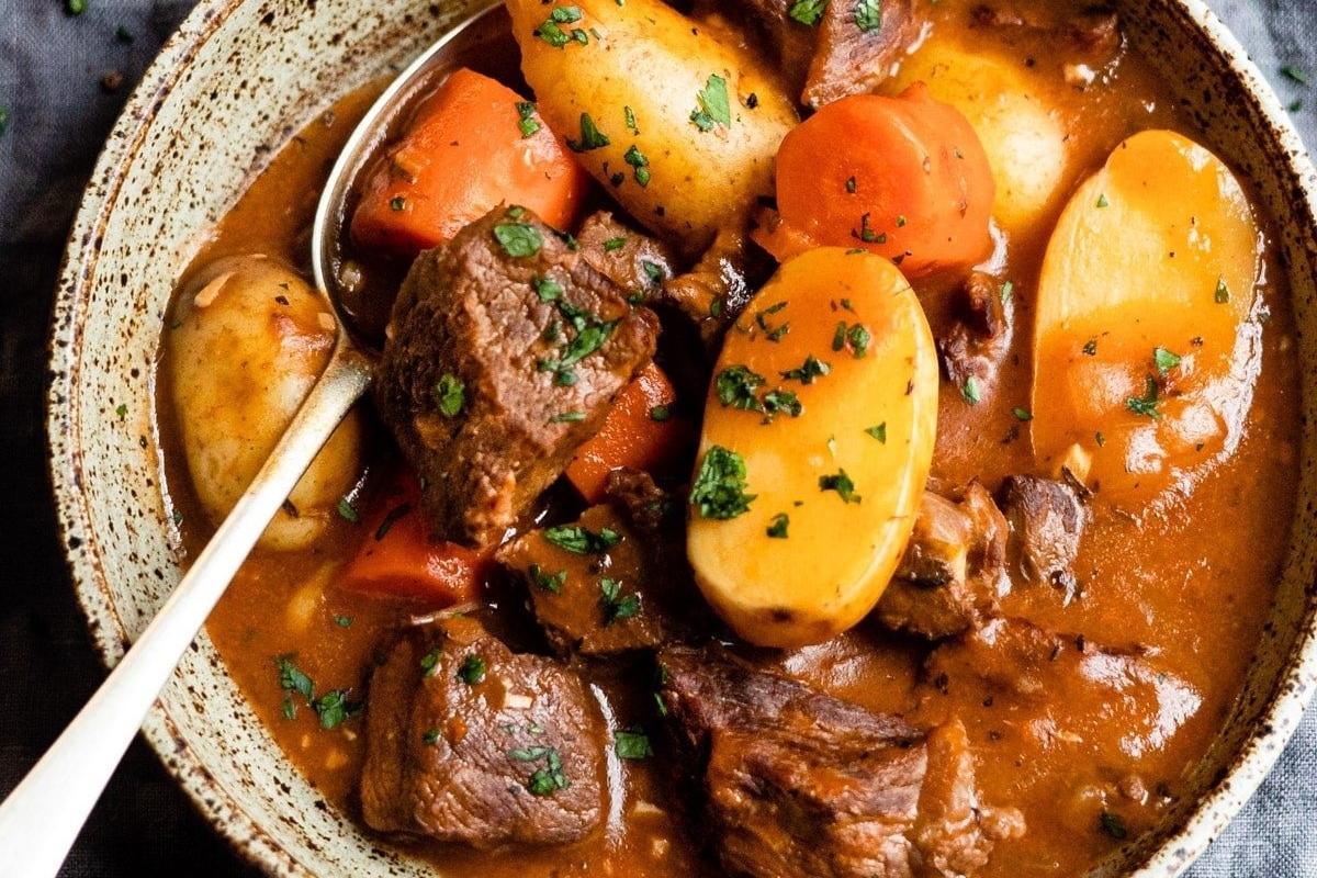 Stew recipe featuring beef, potatoes, and carrots in a comforting bowl.