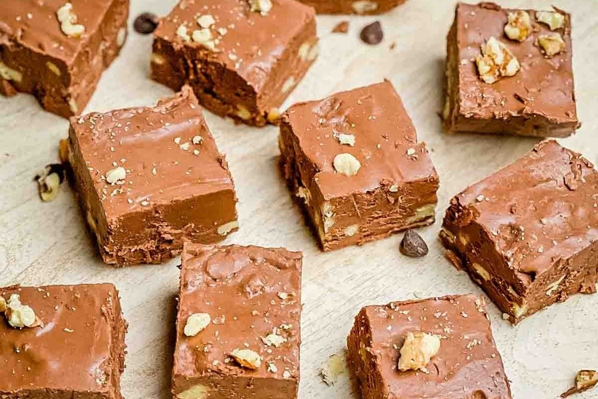 A delightful display of Christmas fudge squares arranged on a cutting board.