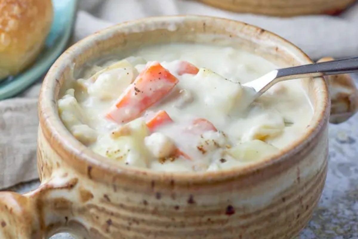 Chicken chowder is a delicious and hearty soup that can be enjoyed in a bowl, accompanied by a spoon. This flavorful dish combines tender chunks of chicken with a creamy broth and an assortment of vegetables