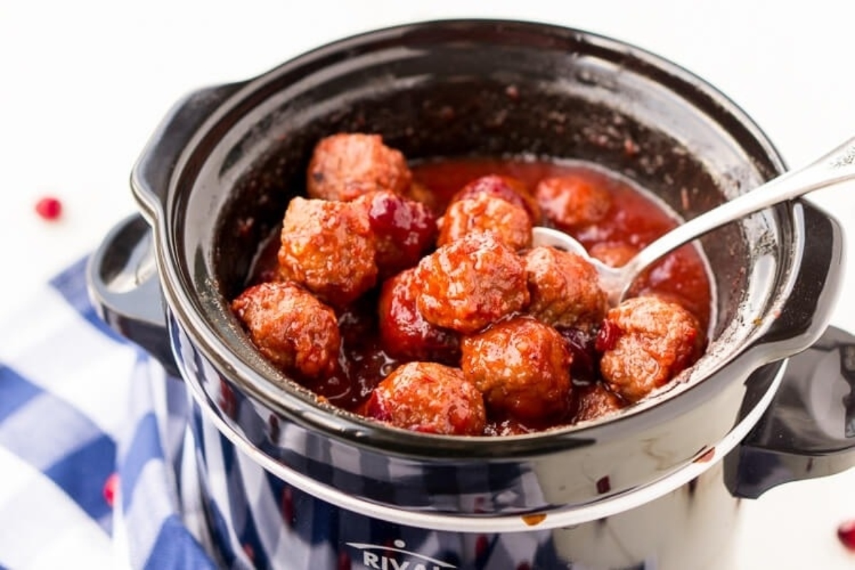 Enjoy a delicious snack of meatballs simmered in a slow cooker and coated with tangy cranberry sauce.