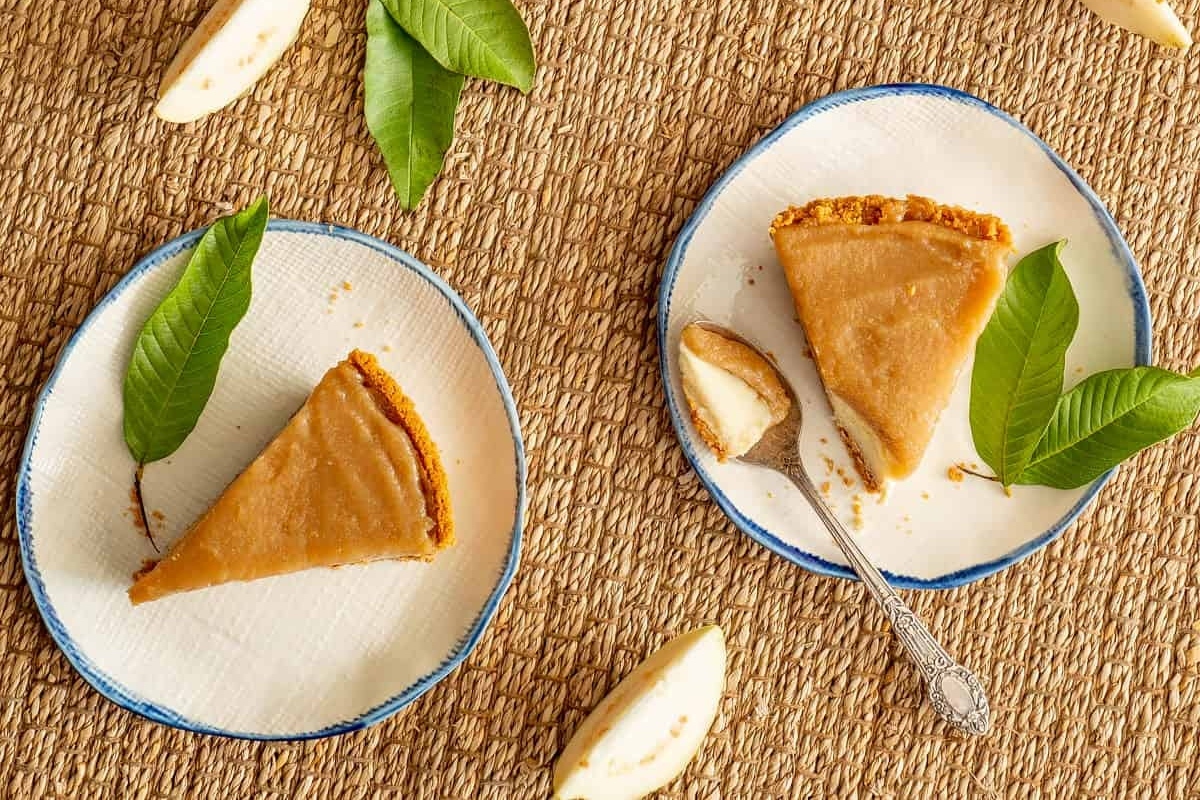 A slice of apple tart on a plate with a spoon.
