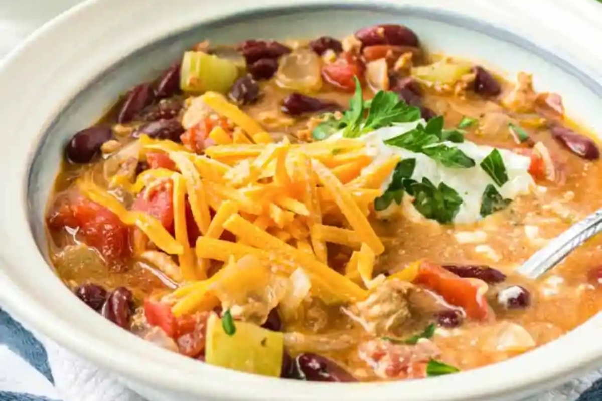 Enjoy a delicious and hearty bowl of chili, complete with flavorful beans, melted cheese, and a dollop of creamy sour cream. Try out some amazing chili recipes today!