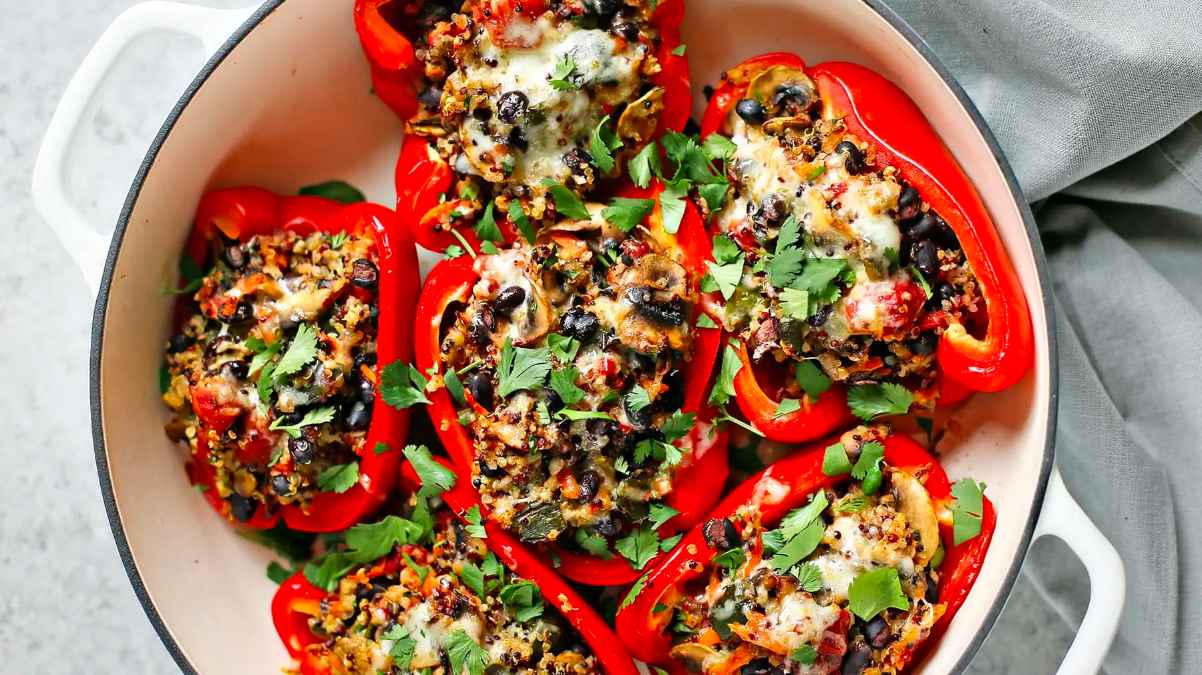 Quinoa stuffed peppers in a pan.