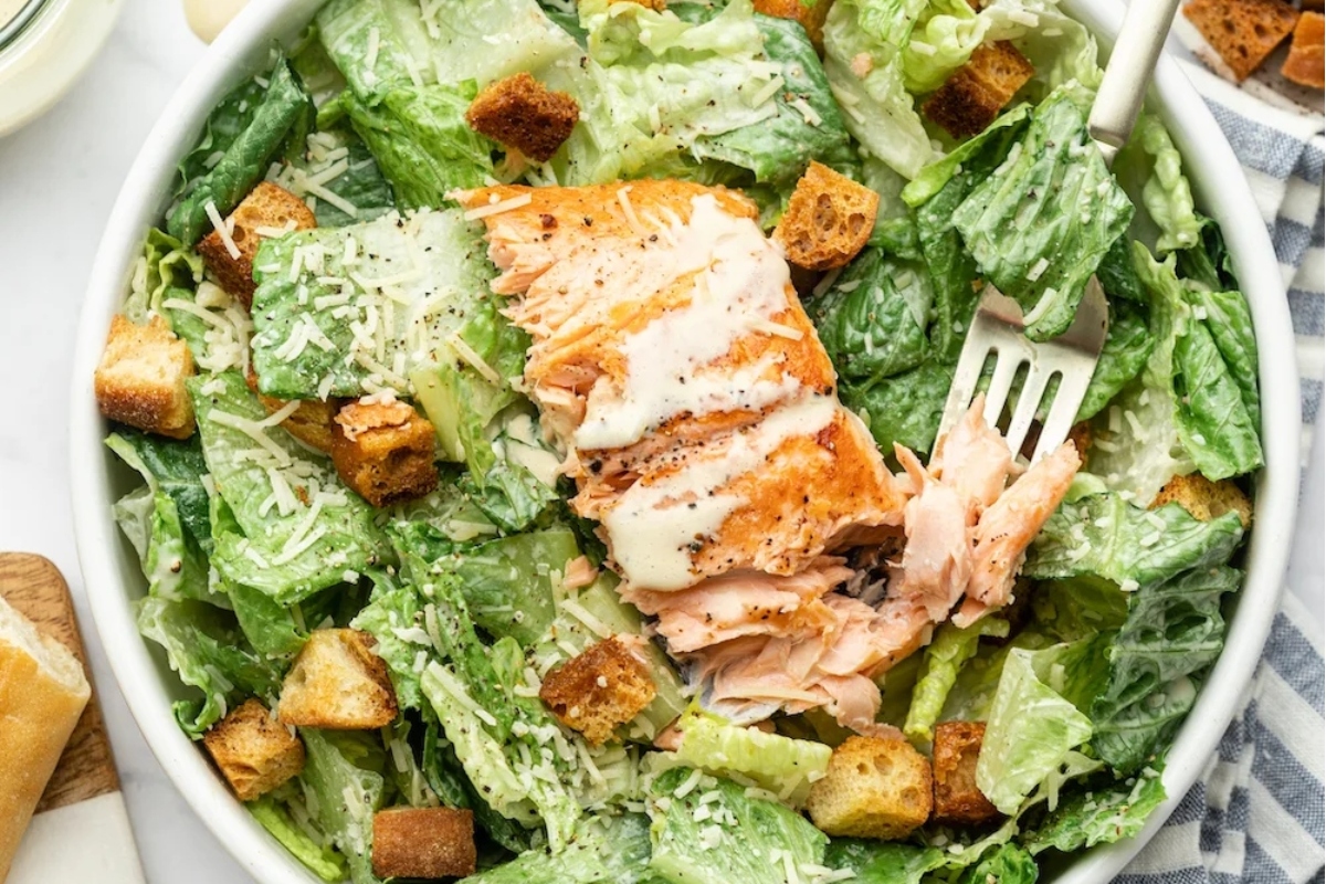 Main Dish Caesar Salad with Salmon and Croutons.