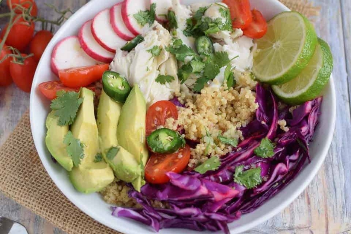 Grain Bowl Recipe with Quinoa Salad, Red Cabbage, Radishes, and Avocado.
