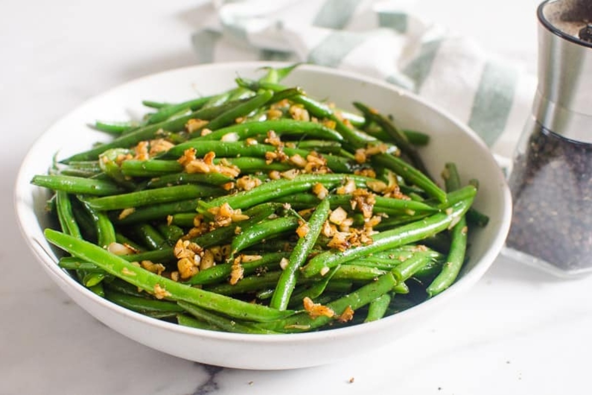 Christmas side dishes in a bowl with salt and pepper.