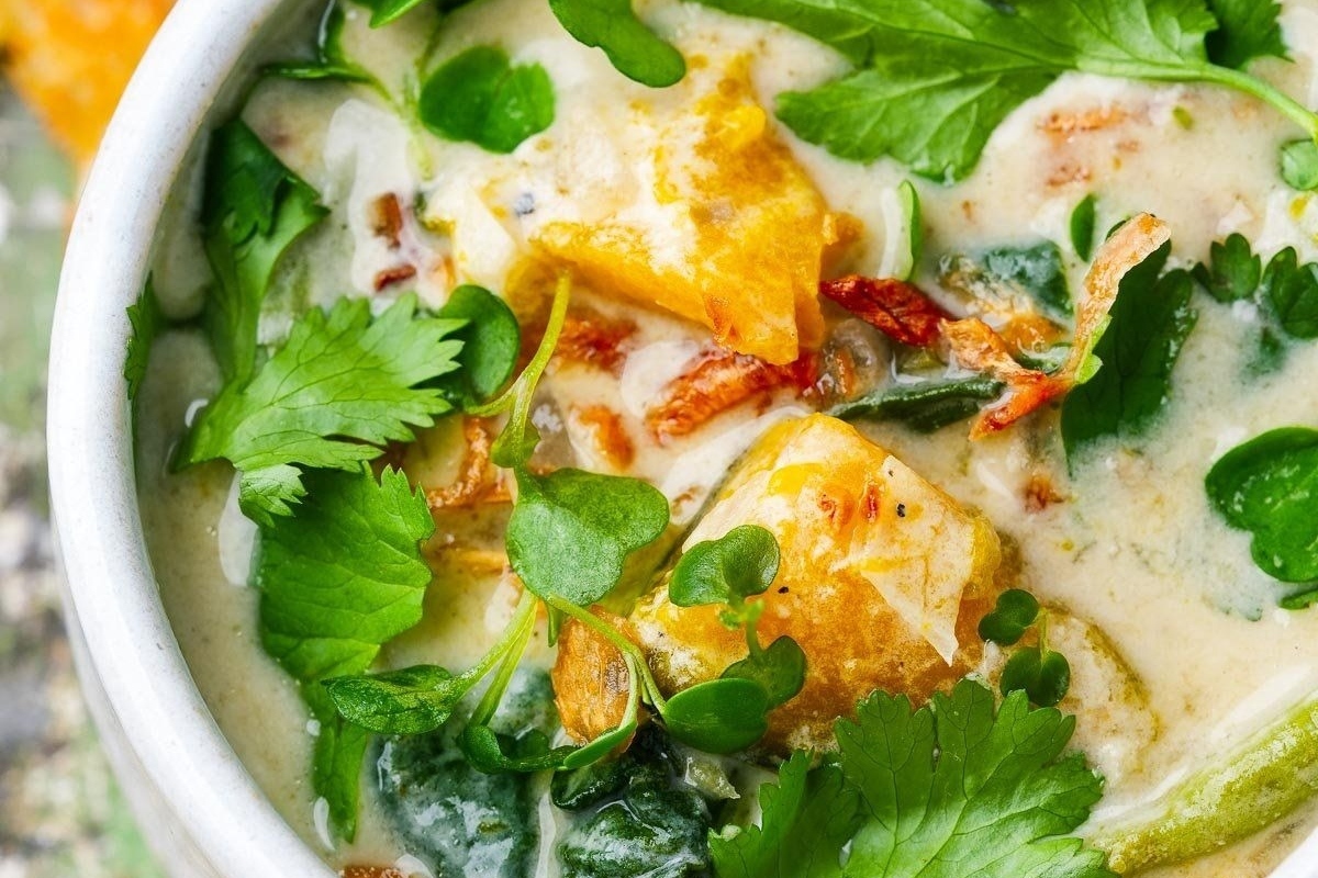 A stew with vegetables and herbs in it, perfect for cozy winter recipes.