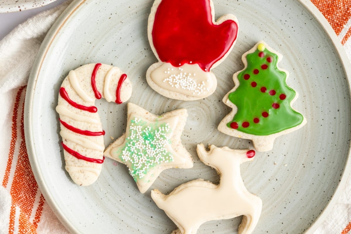 Festive Christmas sugar cookies on a plate.