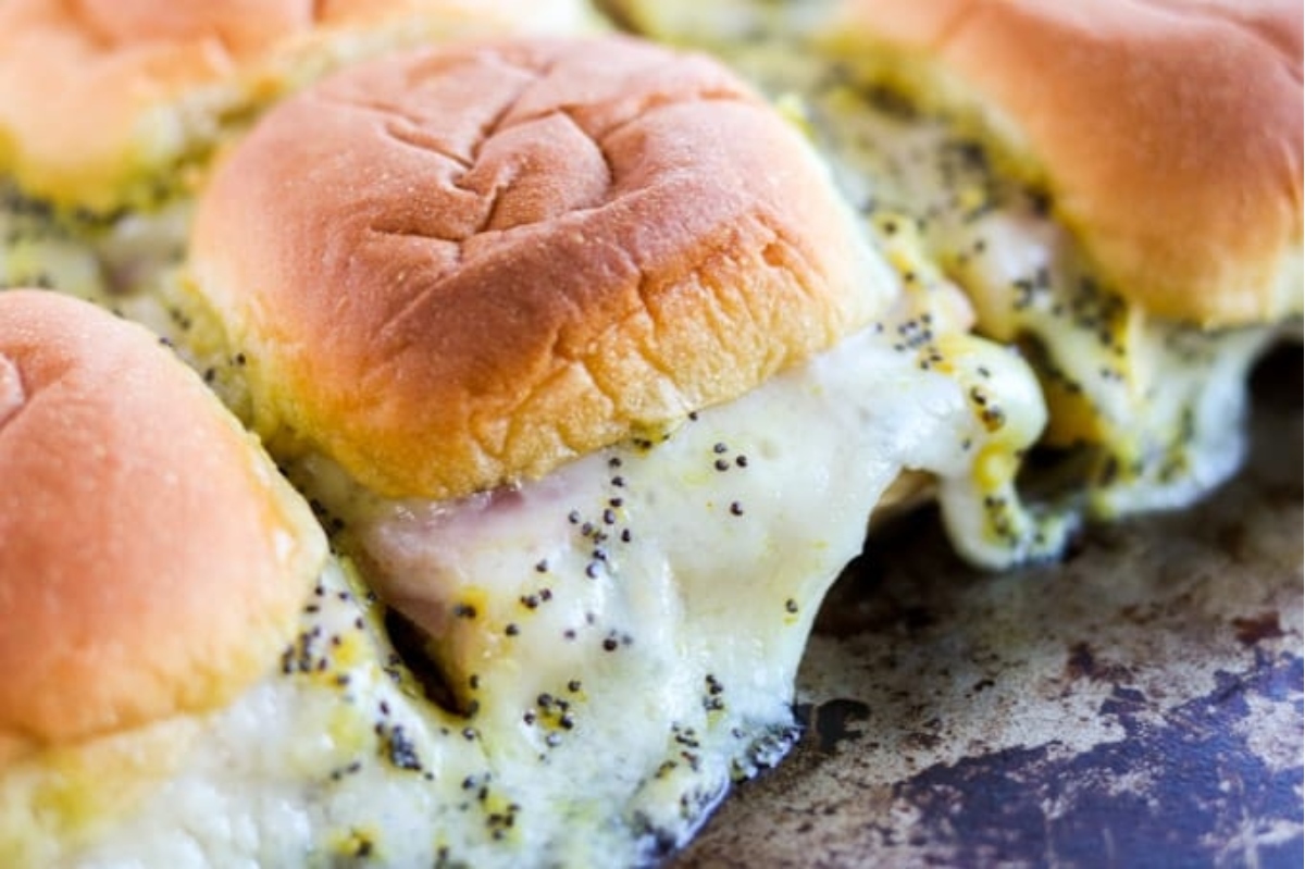 Game day ham and cheese sliders on a baking sheet.