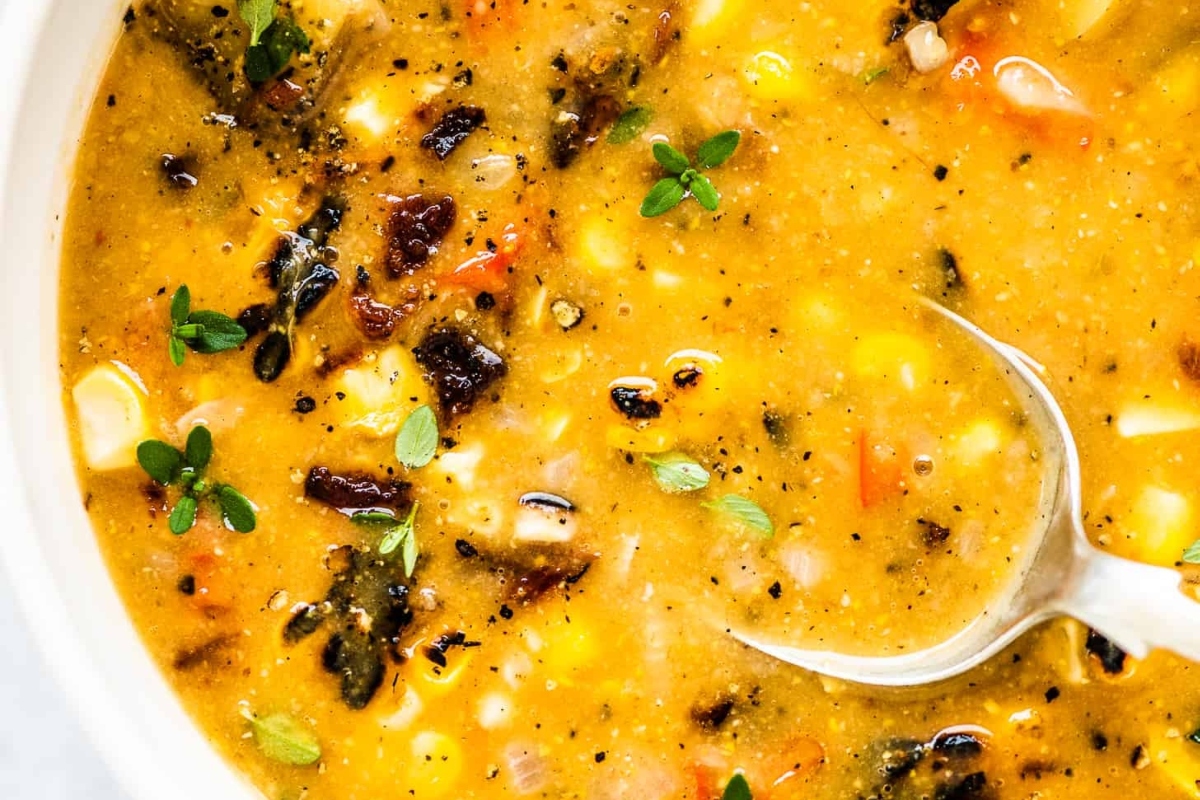 A delicious chowder recipe with a spoon in it.