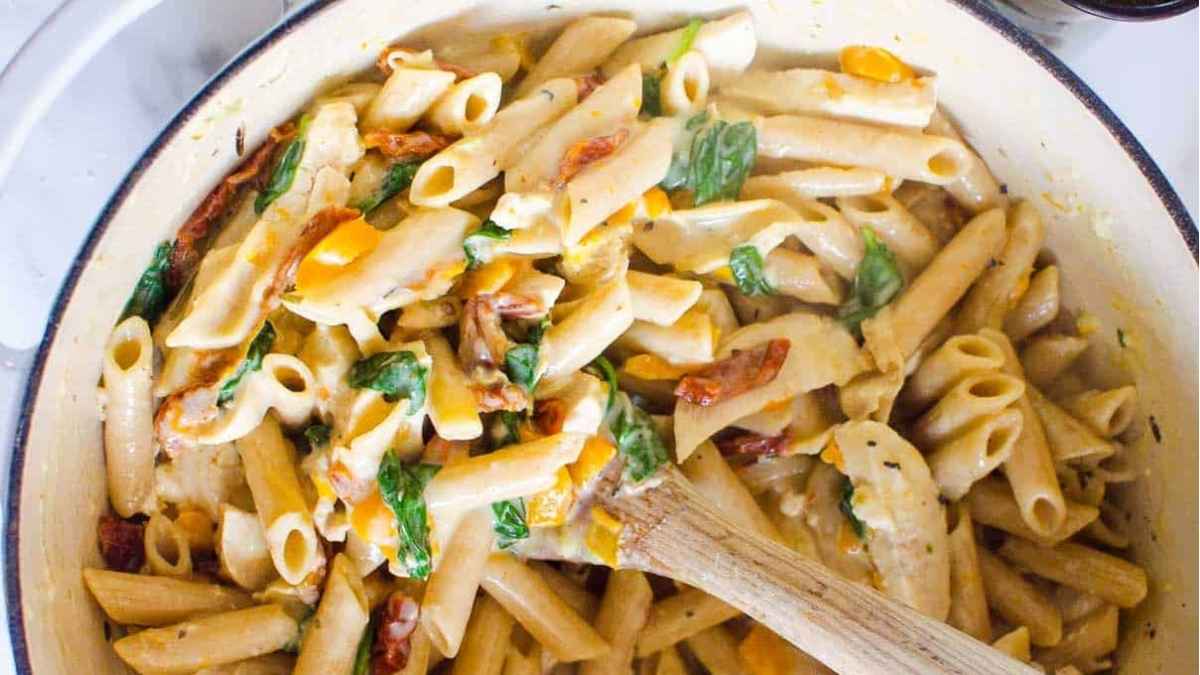 Tuscan chicken pasta on a plate.