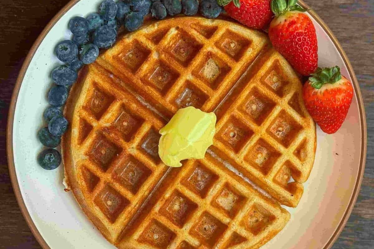 Healthy breakfast with waffles and berries on a plate.