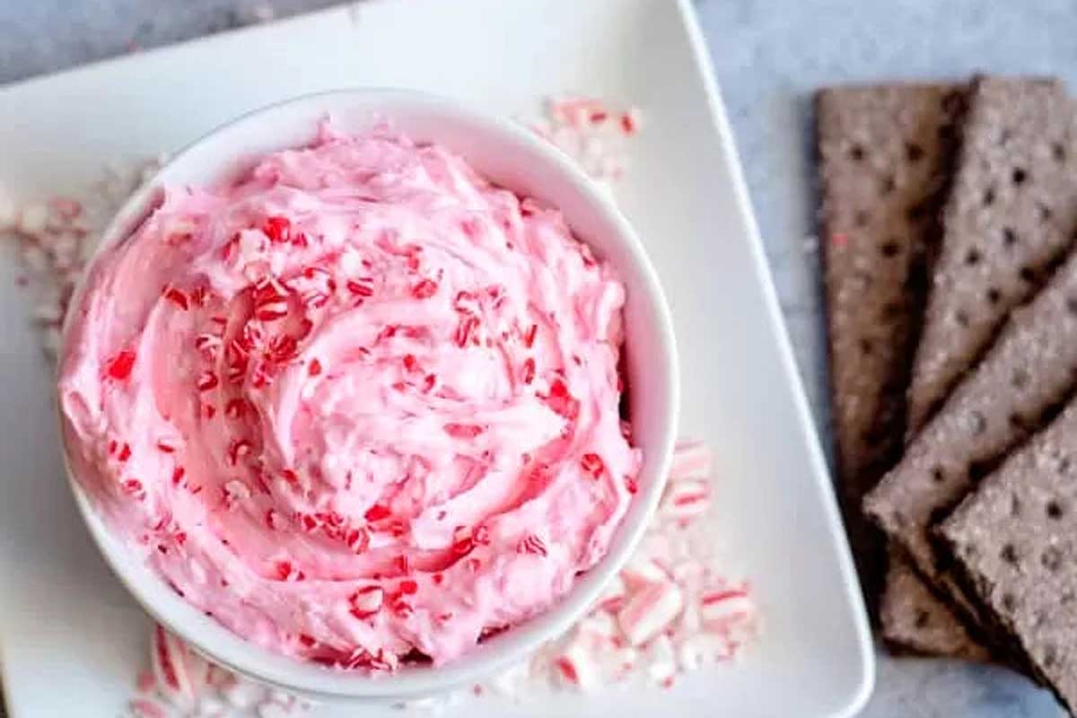 A festive bowl of candy cane dip, perfect for dipping with crackers.