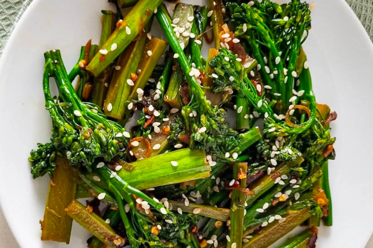 A delicious plate of broccoli with sesame seeds.