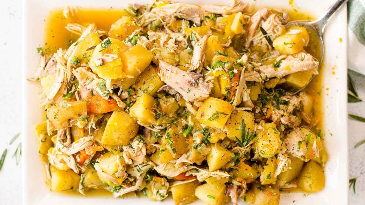 Chicken and potatoes on a plate.