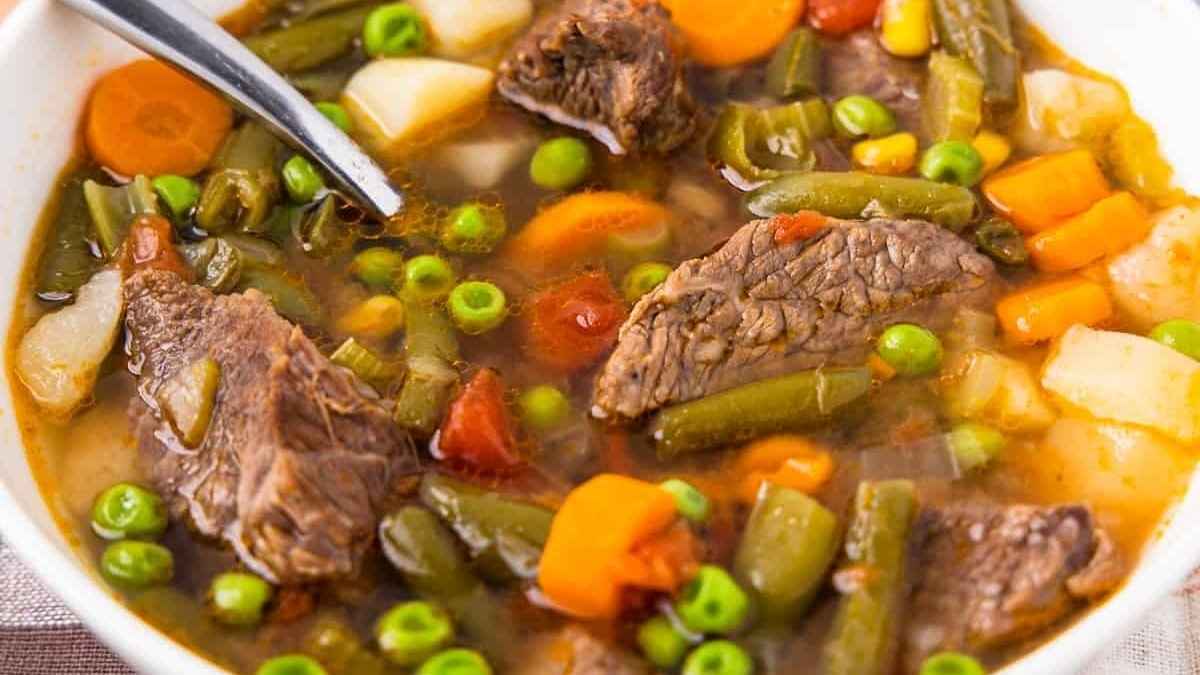 Vegetable soup with peas and carrots.