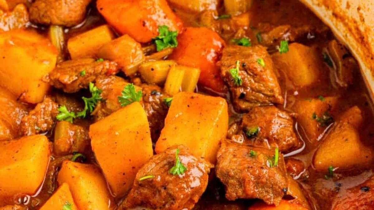 Round up a shared comfort food - Stew with meat and potatoes in a pot.