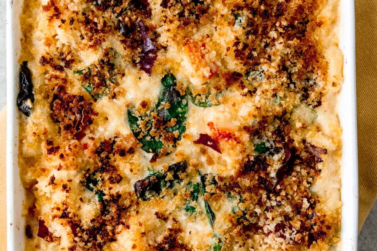 A make ahead casserole dish filled with cheese and spinach.