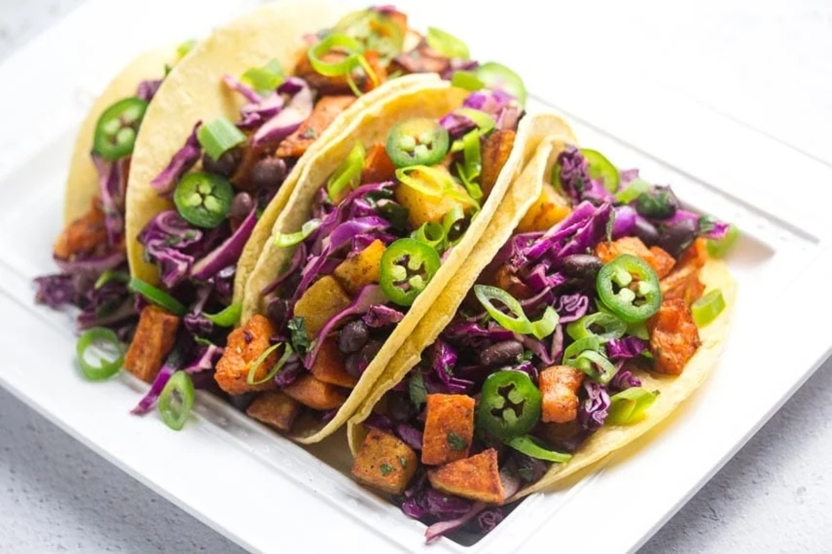 Sweet potato tacos served on a white plate for Taco Night.