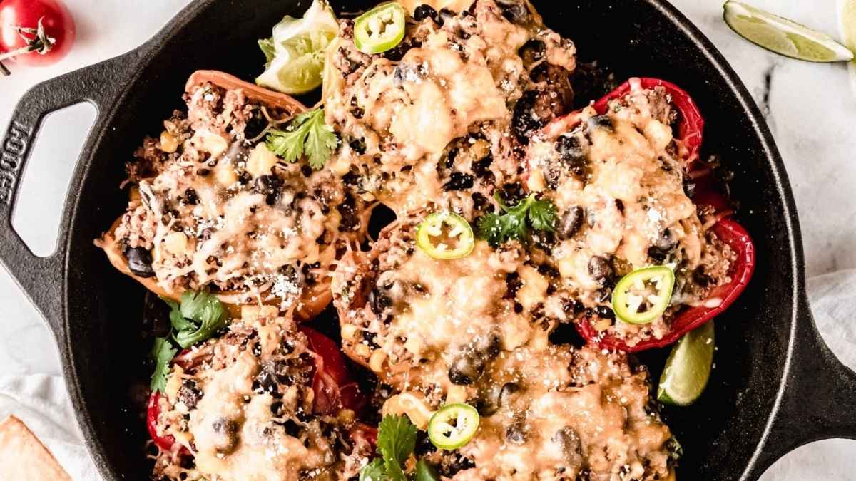 Quinoa stuffed peppers in a pan.