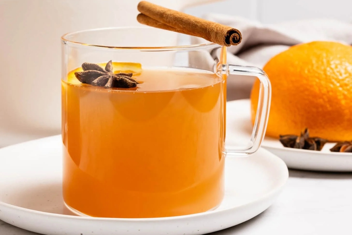 A Thanksgiving-ready cup of mulled cider, infused with the warm flavors of cinnamon sticks and oranges.