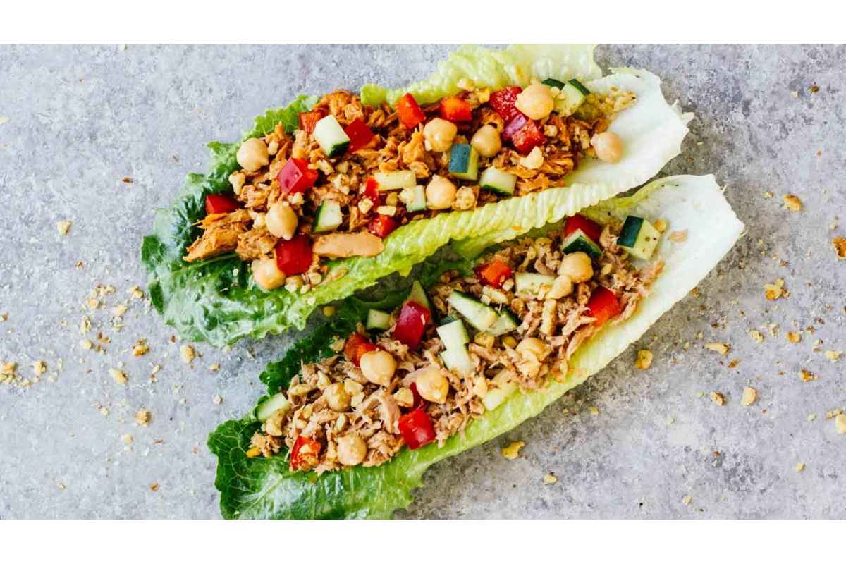 Two healthy lettuce wraps packed with high protein chicken and chickpeas, perfect for lunches.