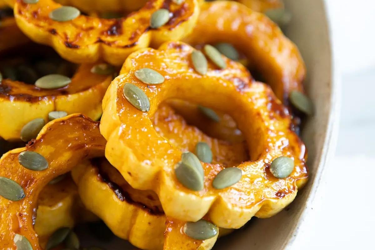 Make-ahead Thanksgiving roasted butternut squash rings served in a white bowl.
