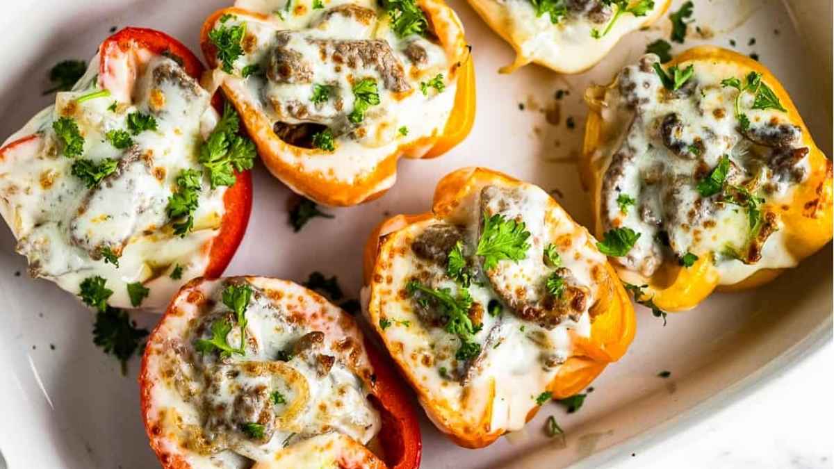 Philly cheesesteak stuffed peppers on a tray.