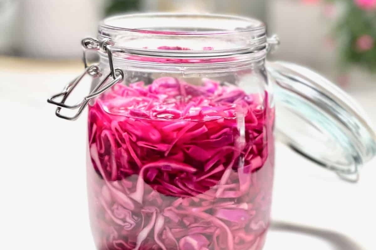 A beautiful gift: a glass jar filled with pink rose petals.