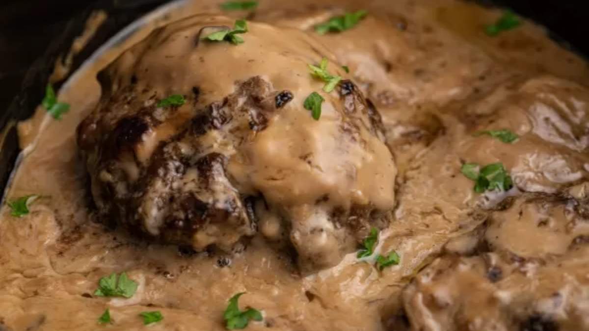 A shared comfort food recipe for delicious meatballs covered in savory gravy cooked in a slow cooker.