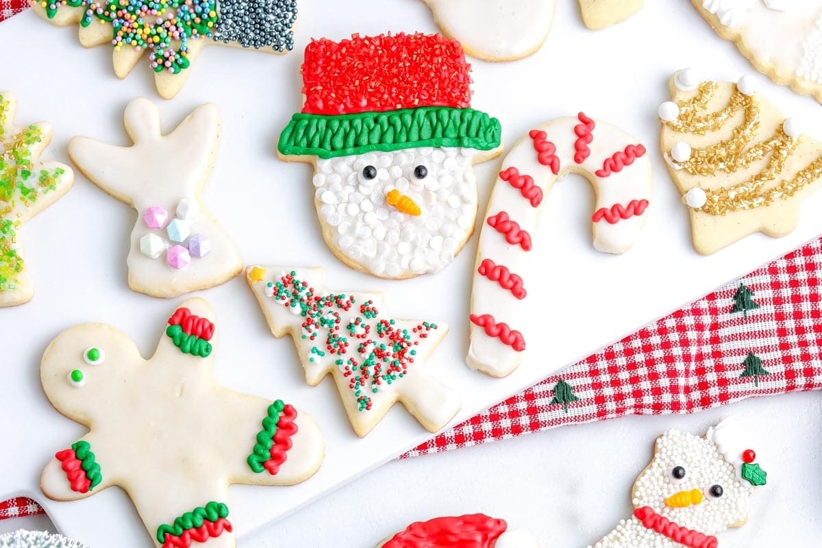 Cut Out Christmas cookies decorated with icing and sprinkles.