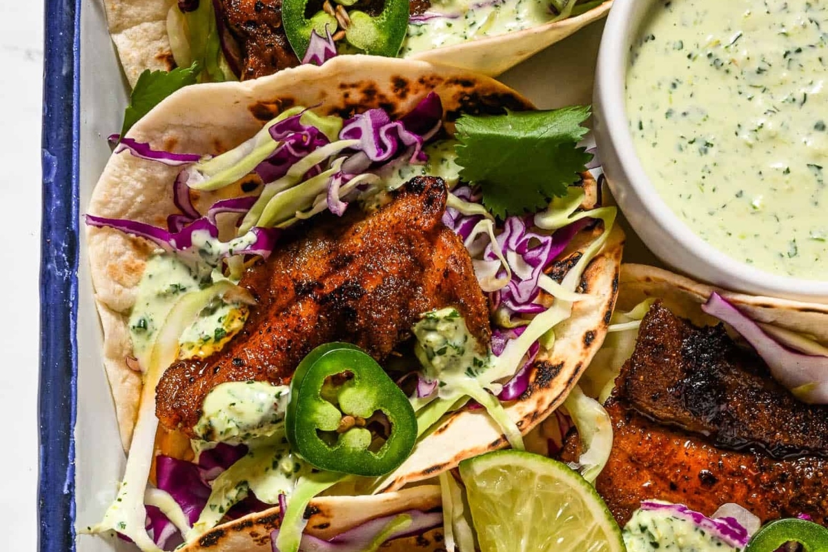 Taco Night: A plate of tacos with a sauce on top, perfect for dinner.