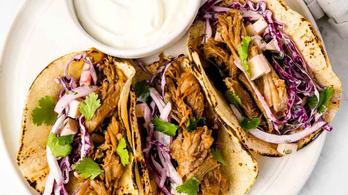 Pork tacos on a plate.
