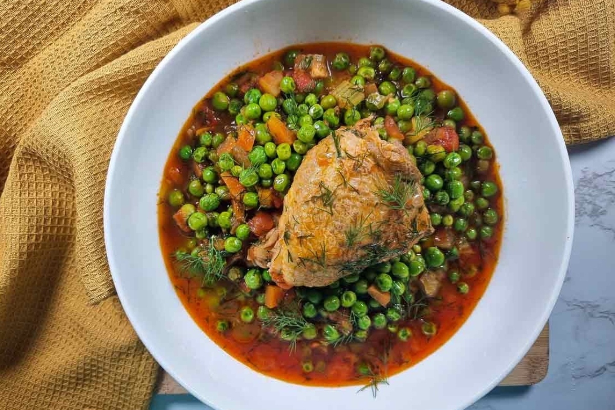 A hearty chicken stew recipe with tender peas and carrots.
