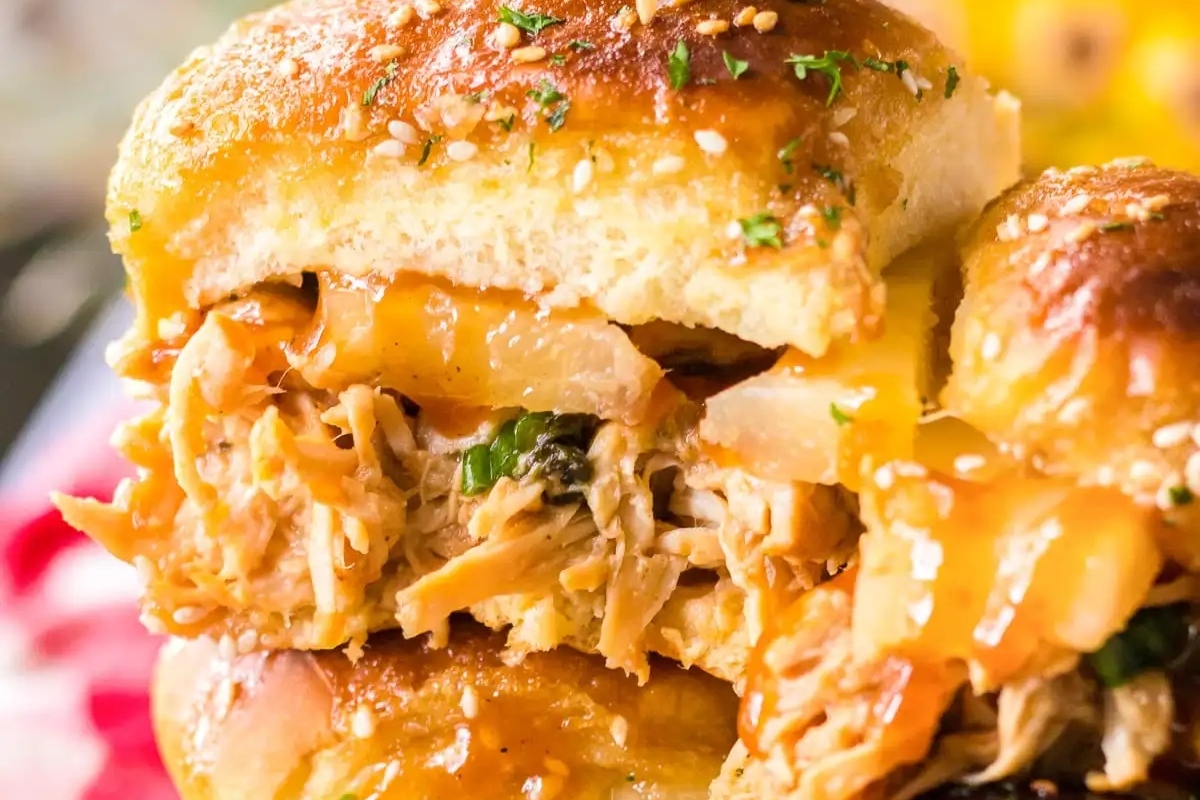 Game Day sliders featuring a stack of hawaiian chicken on a plate.