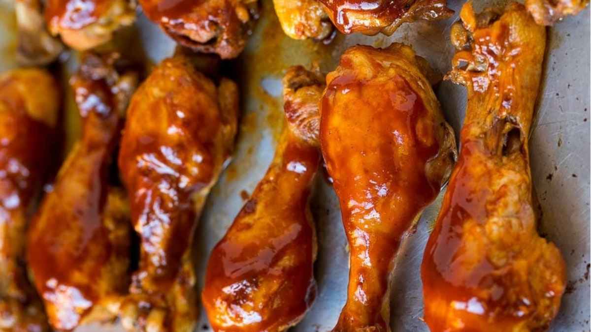 Slow Cooker Bbq chicken wings on a baking sheet.