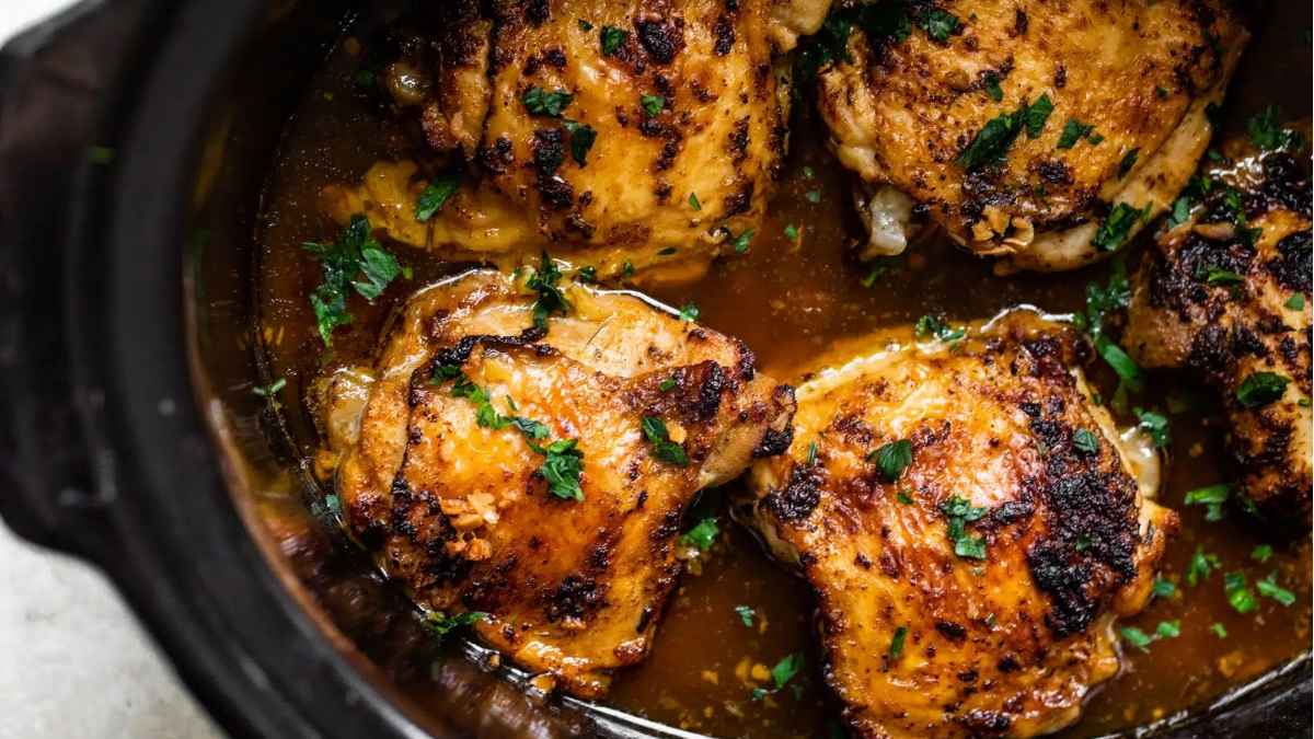Chicken breasts simmered in a delicious slow cooker sauce, creating the perfect chicken dinner.