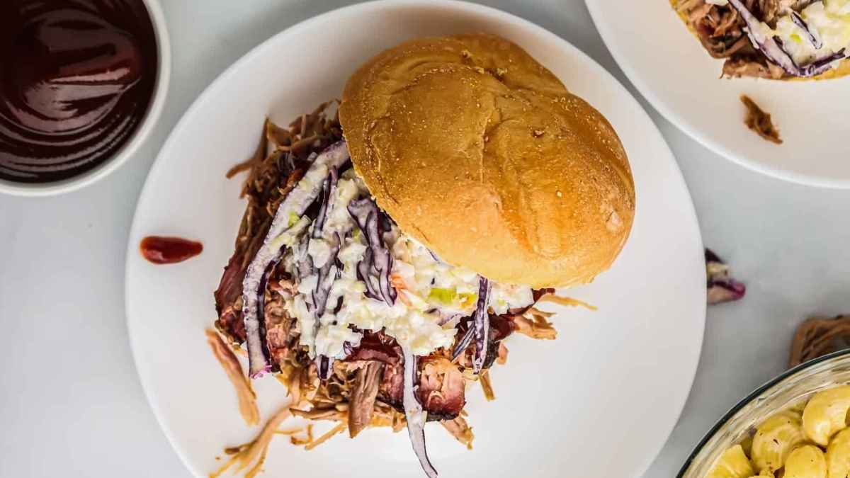 Smoked pulled pork in a bun.