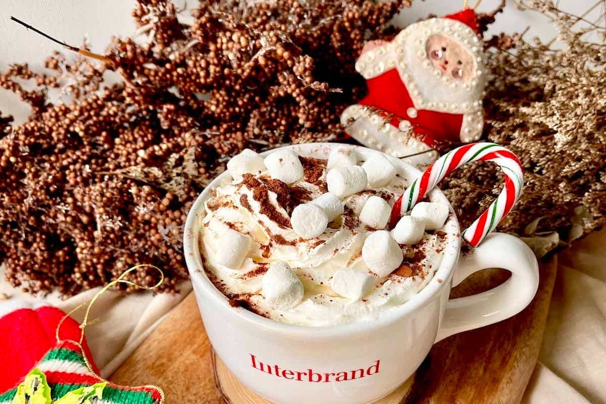 A cup of hot chocolate with peppermint candy canes.