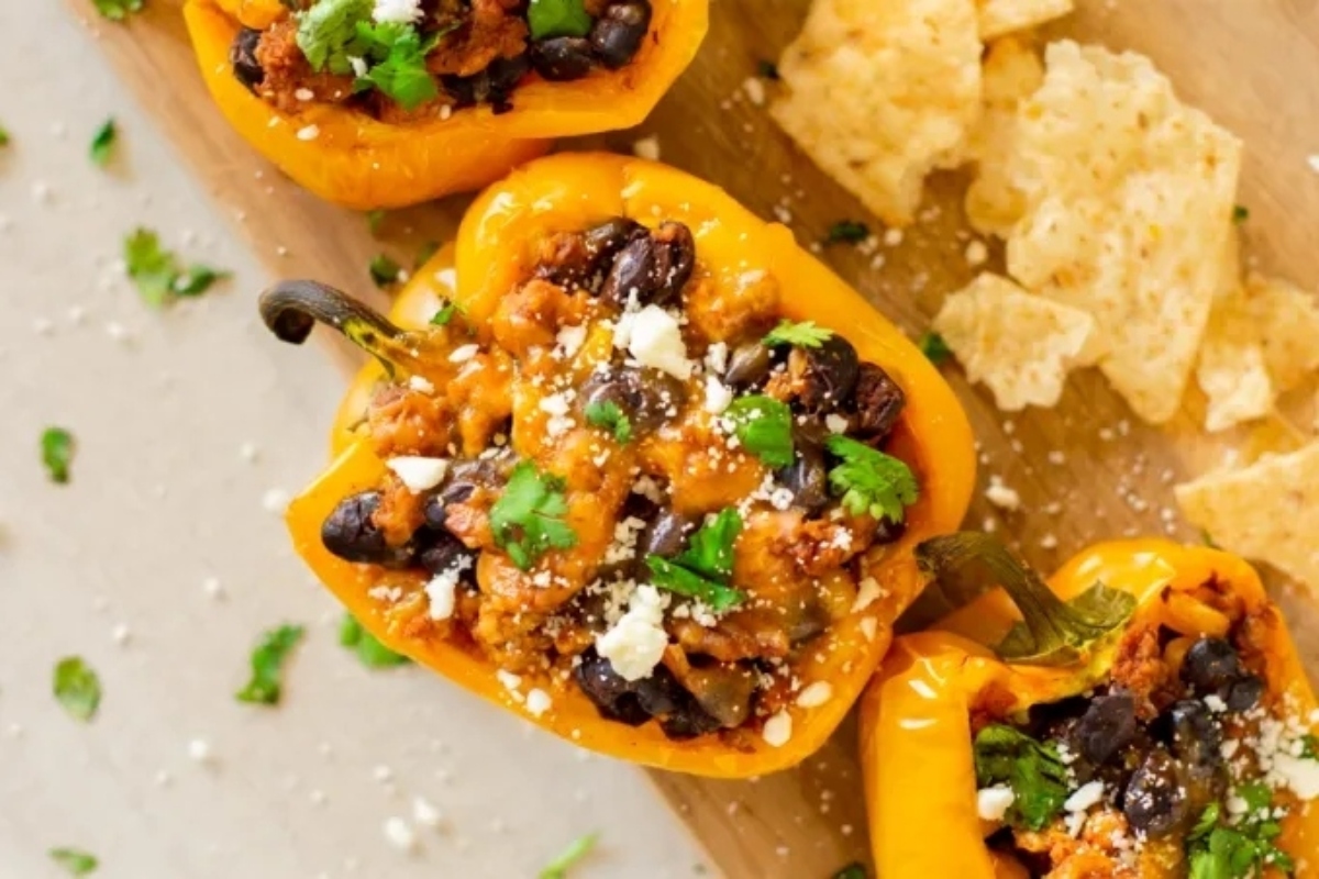 Low carb Mexican stuffed peppers on a cutting board.