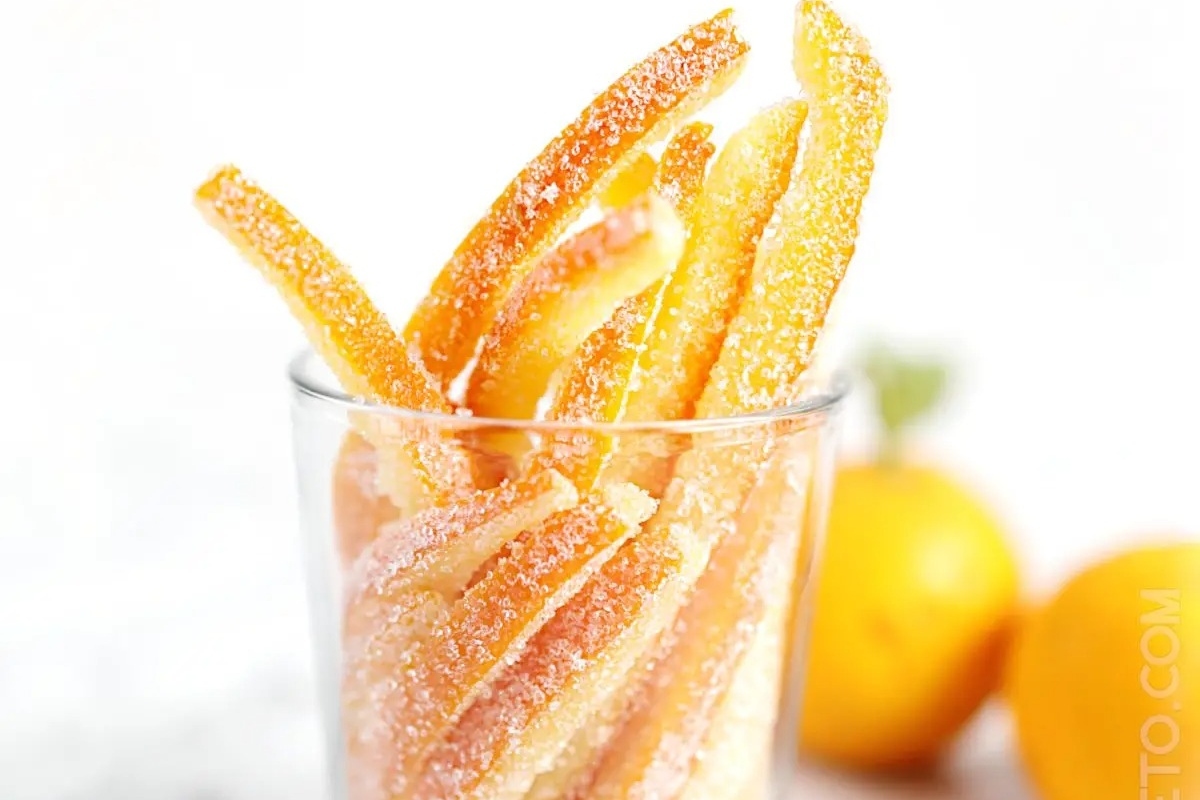A jar filled with sugared orange peels, perfect for gifting.