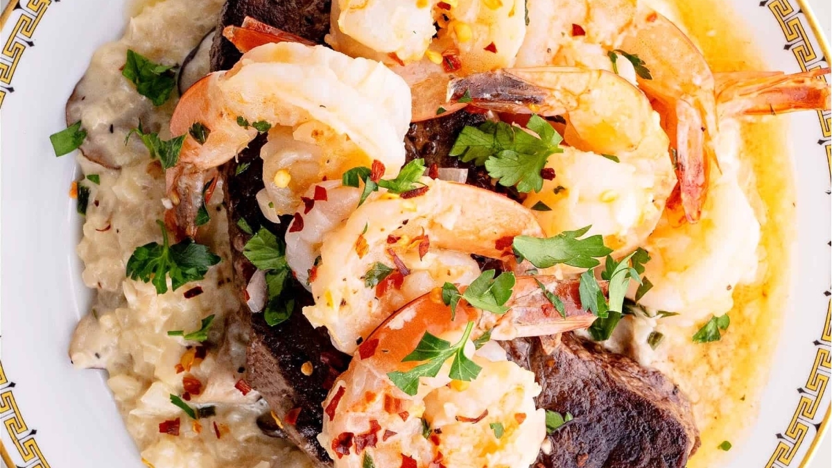 A delightful Valentine's Day main dish featuring a plate of savory shrimp and grits.