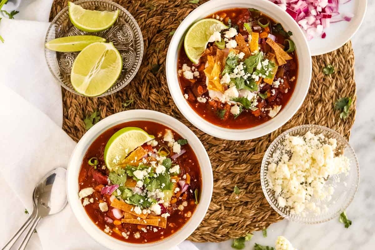 Two bowls of flavorful mexican chicken soup, perfect for chilly days and a delicious addition to your recipe collection.