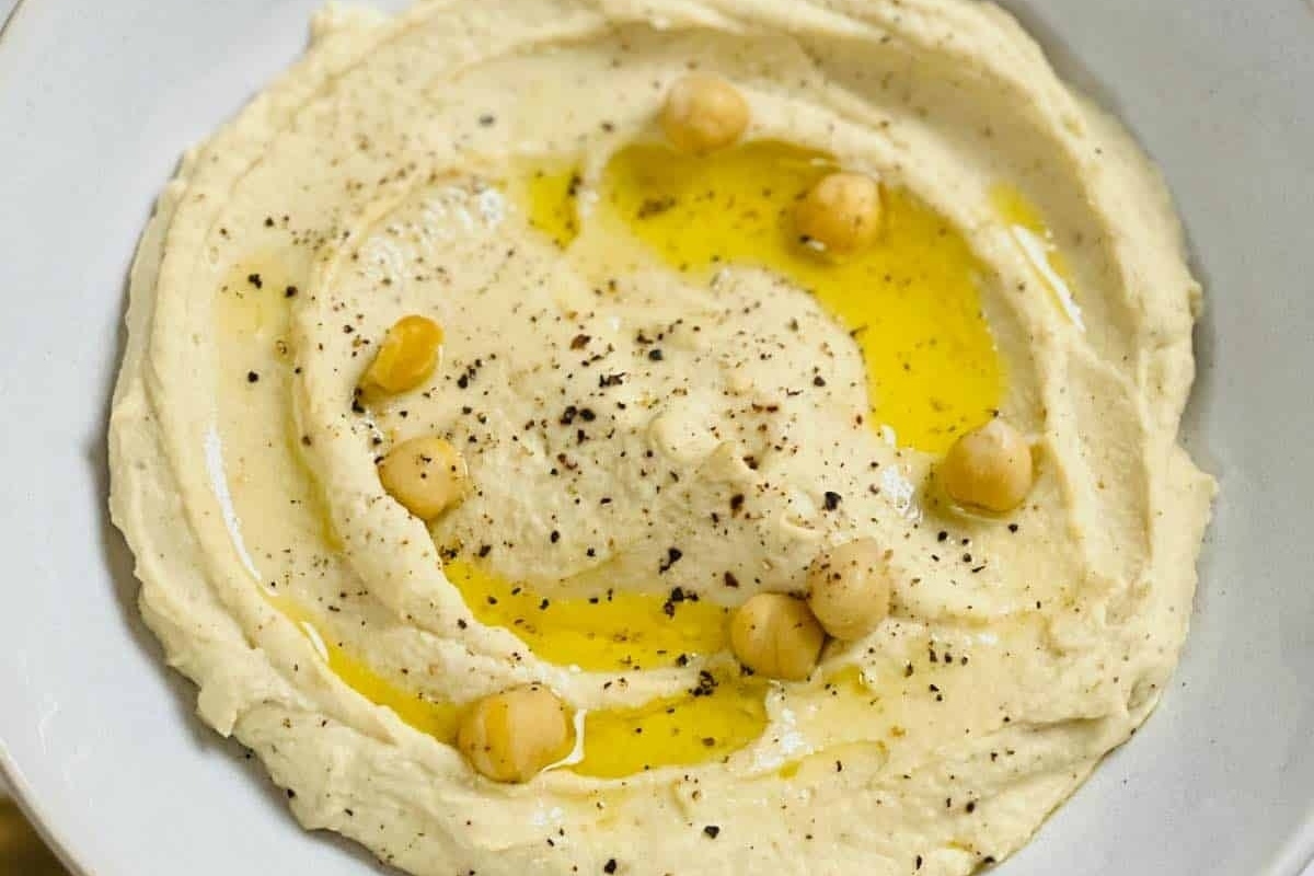 A bowl of hummus with truffle oil.