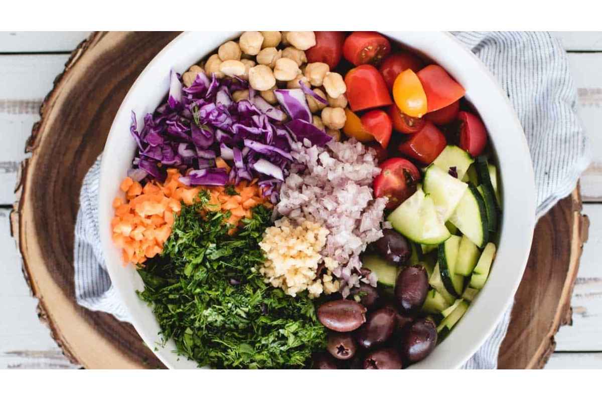 A healthy bowl filled with vegetables, chickpeas, and high protein goodness.