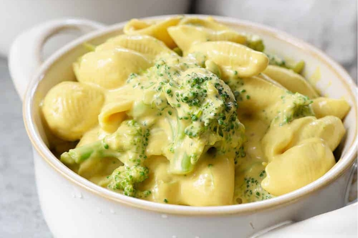 A delicious broccoli pasta recipe with a generous amount of melted cheese.