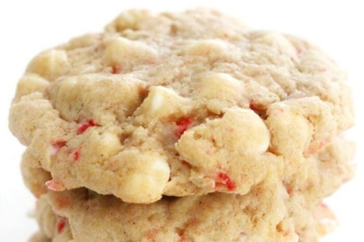 A stack of white chocolate peppermint cookies on a Christmas-themed white background.