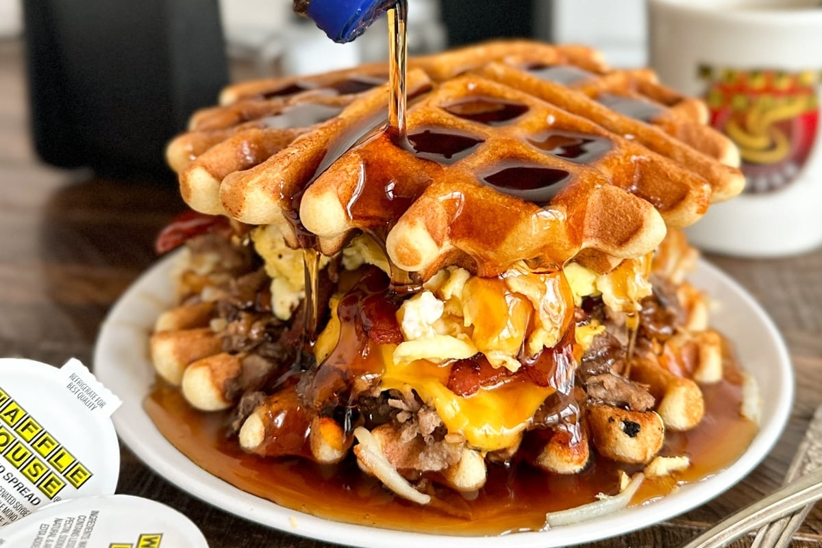 A waffle recipe is being poured onto a plate.
